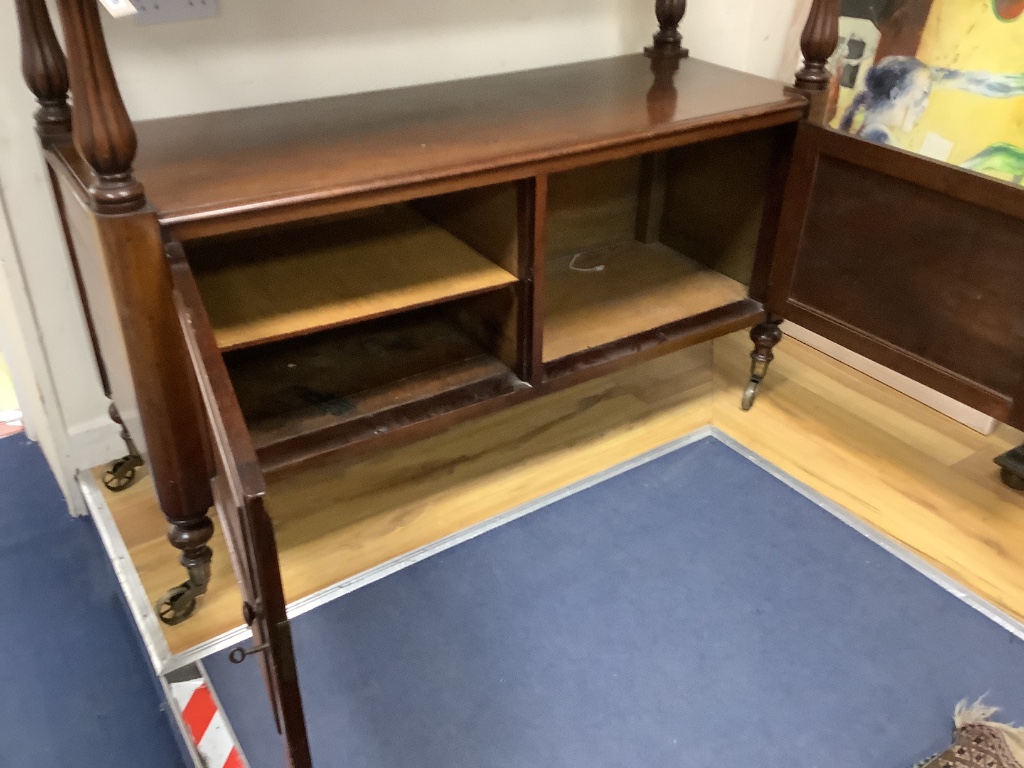 A Victorian mahogany dumb waiter with cupboard below